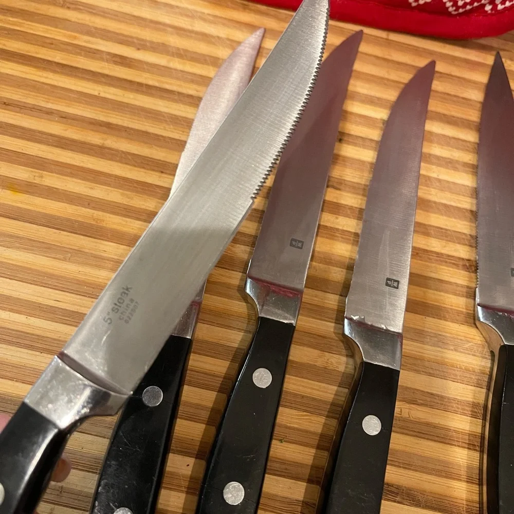 Set of Six Black Handle Wolfgang Puck Steak Knives